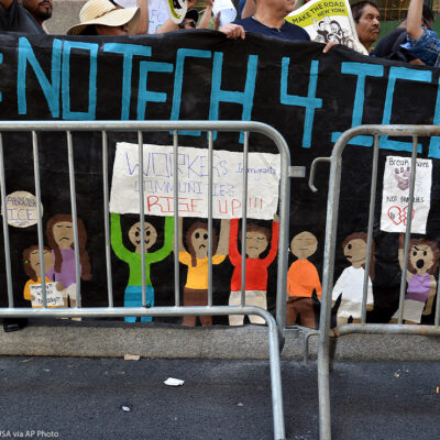 Demonstrators hold banner that reads "#NoTech4Ice"outside Jeff Bezos, CEO of Amazon, Manhattan apartment to protest Amazon technology being used by the Department of Homeland Security.
