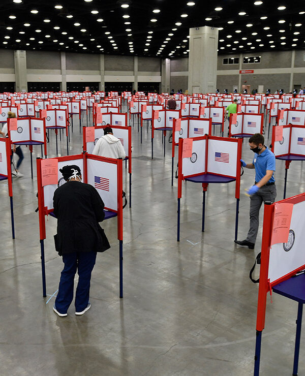 Photo of multiple voting stations set up in the Kentucky Exposition Center for voters to cast their ballot.