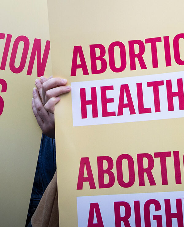 Protest signs advocating for abortion access.