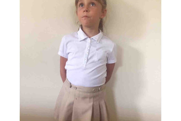 Photo of child in skirt.