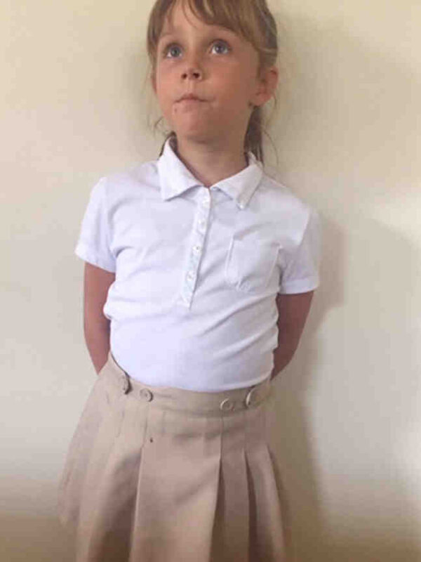 Photo of child in skirt.