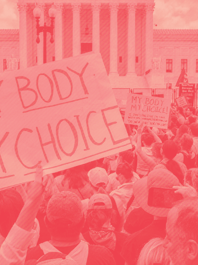 Protest crowd with a sign that says "My Body My Choice"