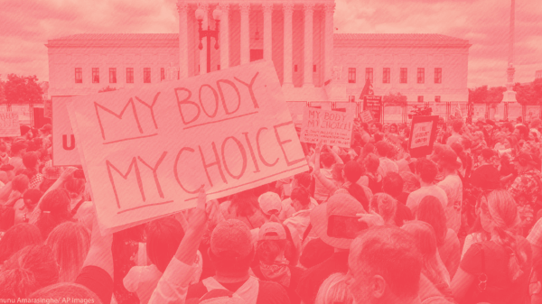 Protest crowd with a sign that says "My Body My Choice"