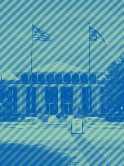 The front of the NC legislative blue with a green and teal overlay.