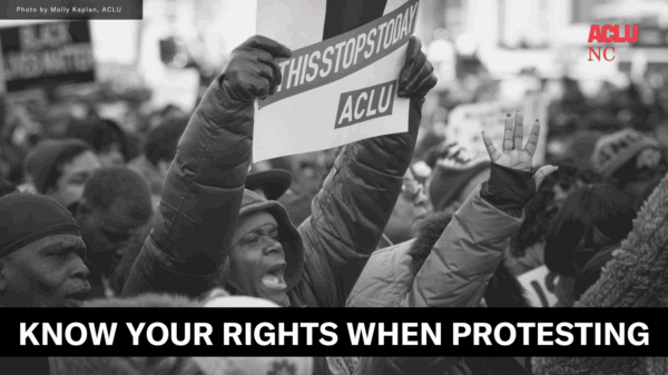 People protesting holding a sign