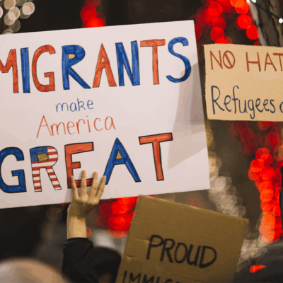 Protest photo with huge sign that says "Immigrants make America great"