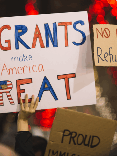 Protest photo with huge sign that says "Immigrants make America great"