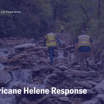 Hurricane Helene Response, photo of NCDOT workers traversing a river