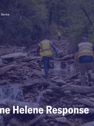 Hurricane Helene Response, photo of NCDOT workers traversing a river