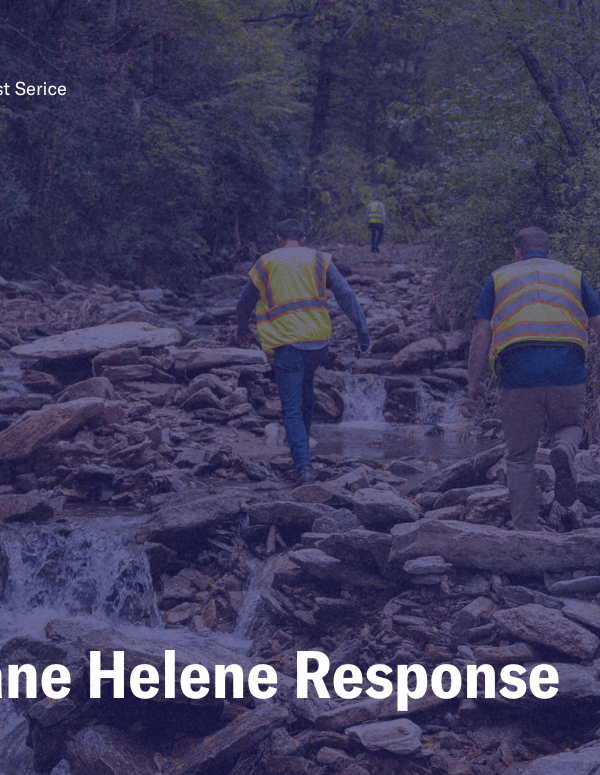 Hurricane Helene Response, photo of NCDOT workers traversing a river