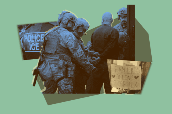 ICE agents arrest an individual with a protest sign saying "Families Belong Together."