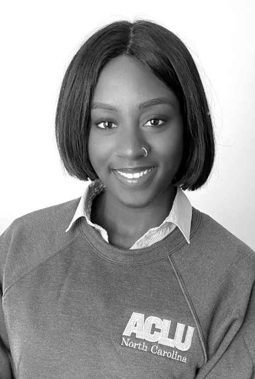 Black and white photo of Acacia Cadogan wearing an ACLU sweatshirt