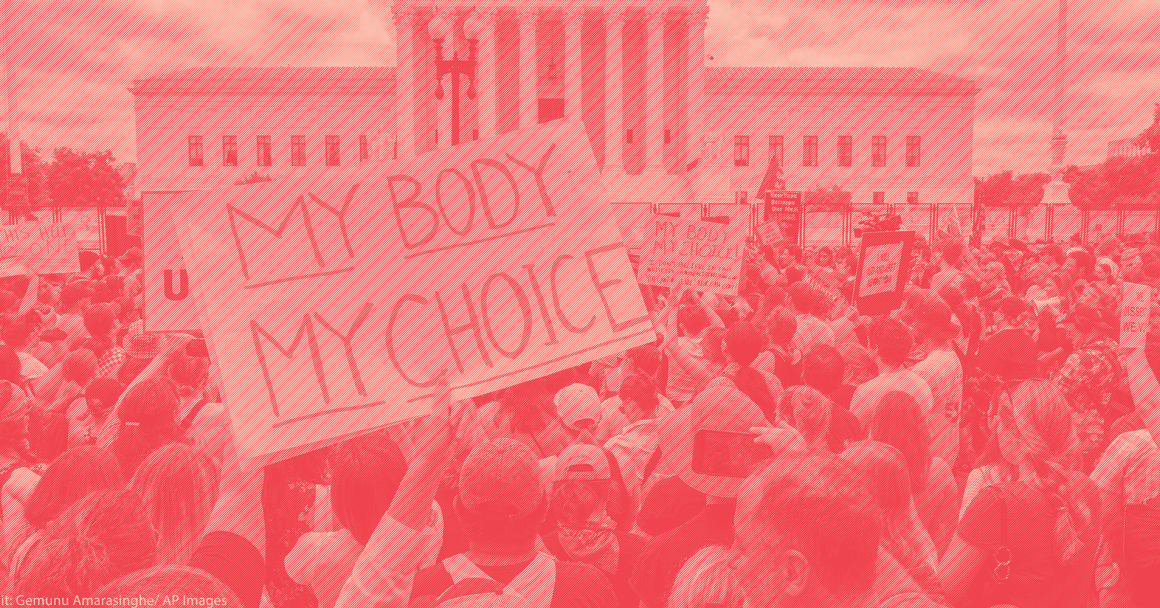 Protest crowd with a sign that says "My Body My Choice"