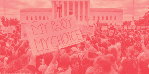 Protest crowd with a sign that says "My Body My Choice"