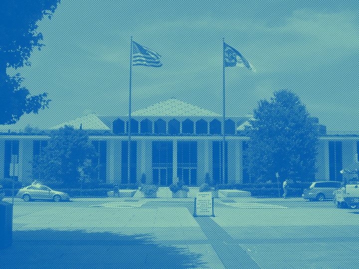 The front of the NC legislative blue with a green and teal overlay.