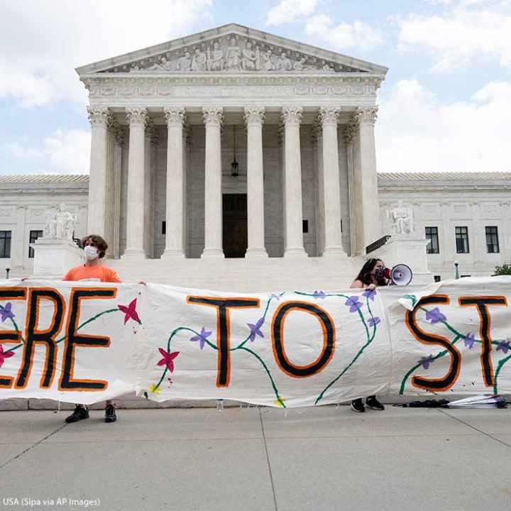 "Here to Stay" banner at a rally in favor of DACA (Deferred Action for Childhood Arrivals) is seen in front of the Supreme Court.