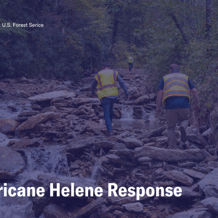 Hurricane Helene Response, photo of NCDOT workers traversing a river