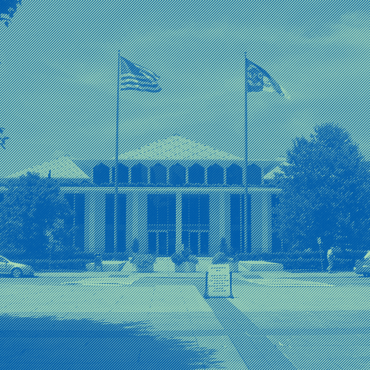 The front of the NC legislative blue with a green and teal overlay.