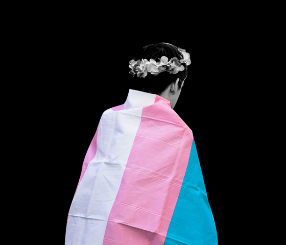 youth wearing a transgender flag